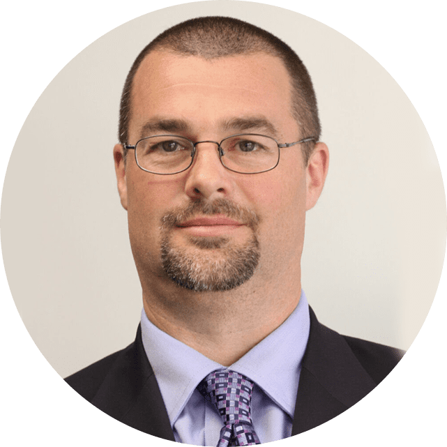 Professional man in glasses wearing a suit and tie.